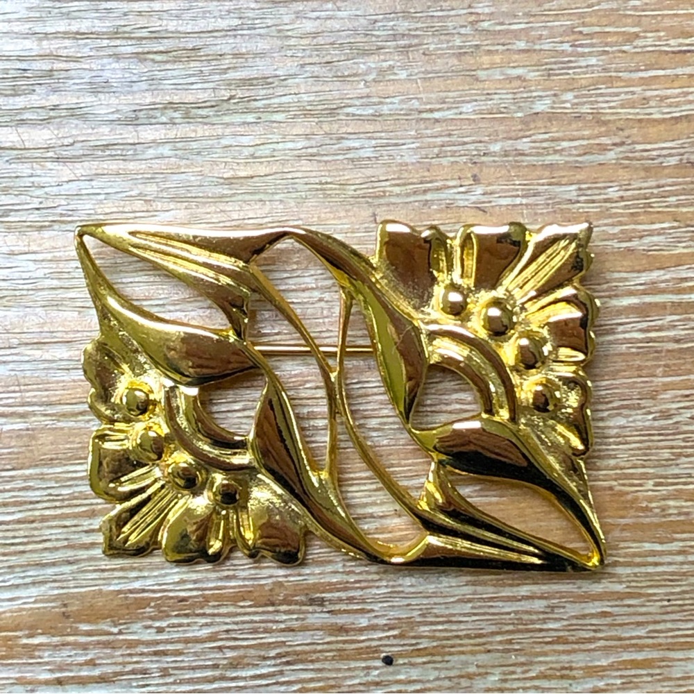 Gold colored pin